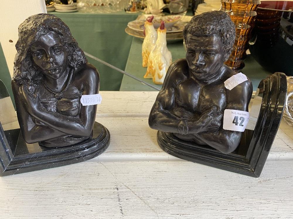 A pair of Bronze and marble bookends