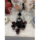 A decanter and six glasses,