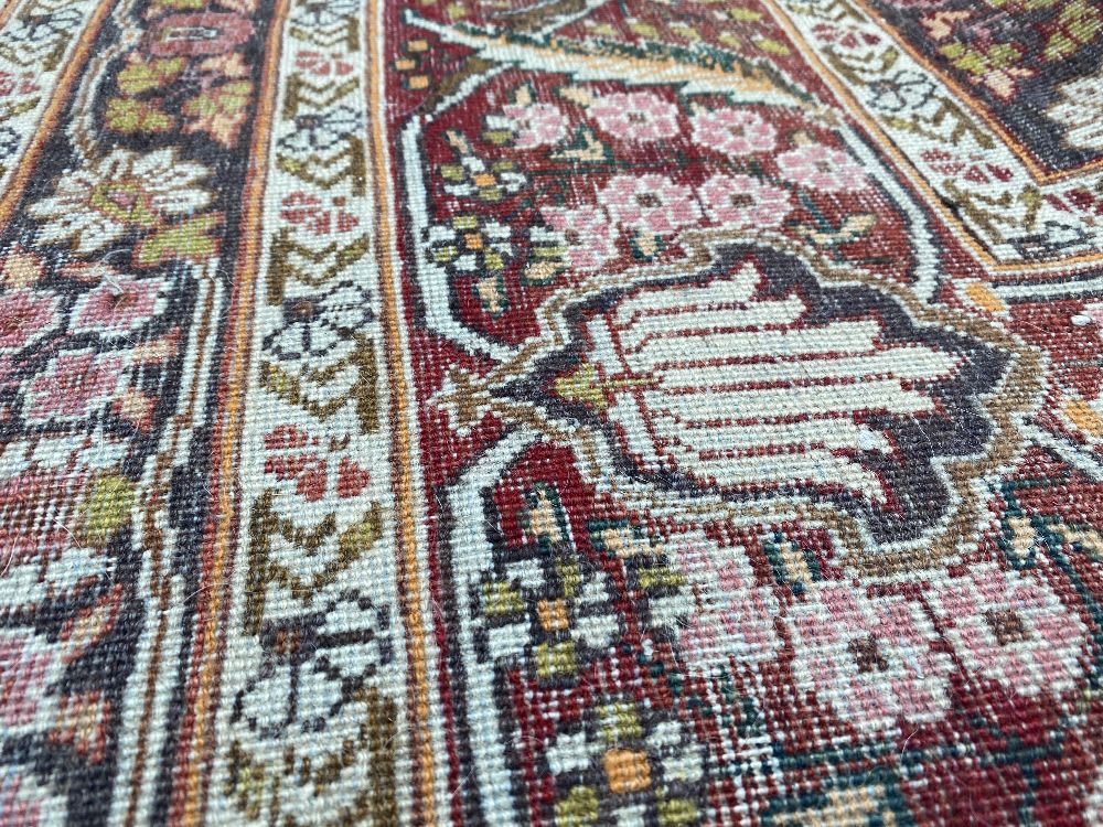 A large Persian rug, - Image 43 of 46