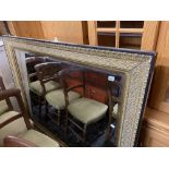 A large gilt wall mirror