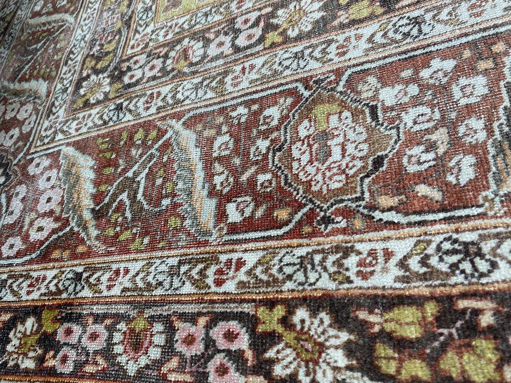 A large Persian rug, - Image 13 of 46