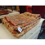 A large brown/ red Persian rug 6ft by 10ft