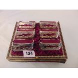 A boxed set of six napkin rings, boxed, box a.