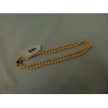 A set of Pearls with 9ct Gold Pearl and Amethyst clasp