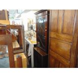 A mahogany bookcase on a cupboard base