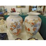 A pair of Orange and White vases