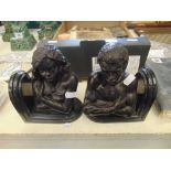 A pair of Bronze and marble bookends