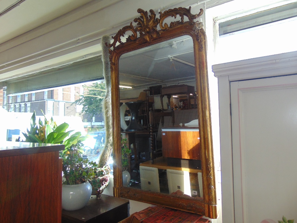 A late 19th century gilt over mantle mirror