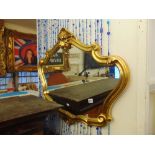 A decorative gilt mirror