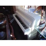 A White Artdeco style Piano and stool