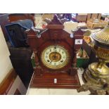 A wooden clock, with key,