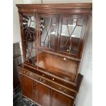 A Mahogany bookcase on cupboard base