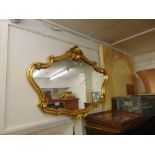 A decorative gilt mirror