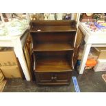 An Ercol waterfall bookcase