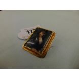 A hand painted porcelain brooch, with portrait, in a 18ct hallmarked gold frame, German, 3.