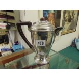 A hallmarked Artdeco silver teapot with Bakelite handle,