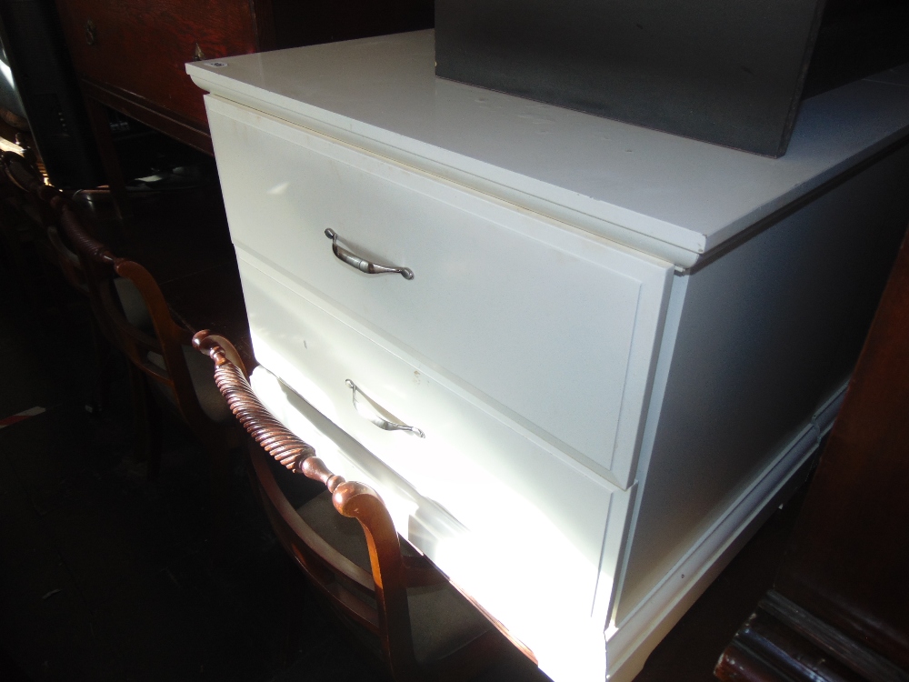 Two white two drawer chests