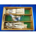 A collection of hallmarked silver knives, forks plus cream jug, approx.