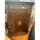 A 19th century inlaid Oak corner cupboard