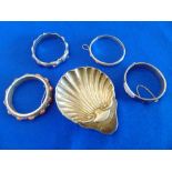 Four silver bangles and a Oyster dish