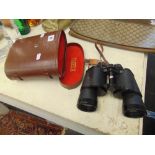 A cased pair of binoculars,
