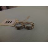 A pair of hallmarked 9ct white gold triple hoop diamond set earrings