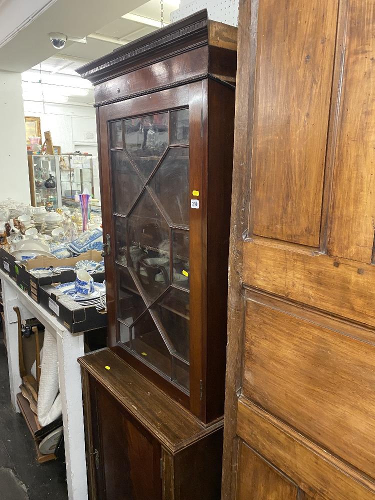 A mahogany bookcase on a cupboard base