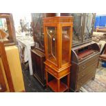 A display cabinet on stand,