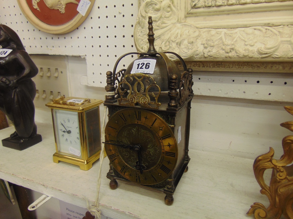 A brass lantern clock