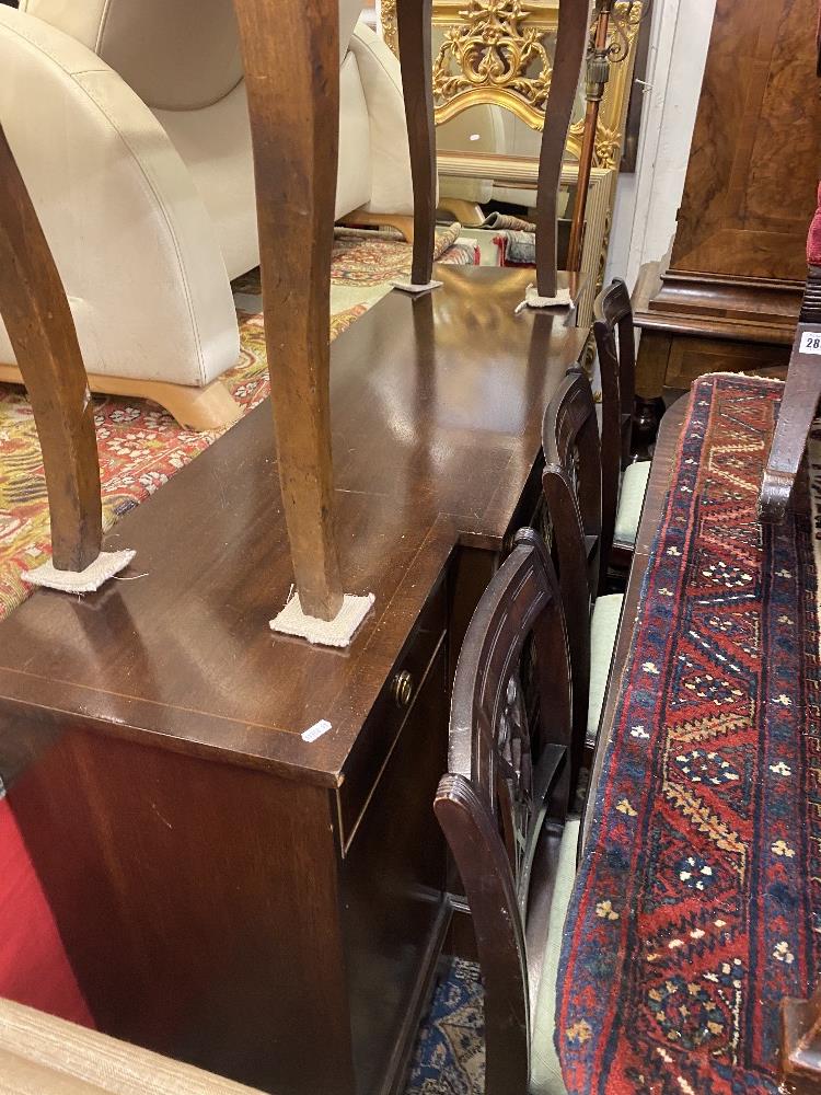 A Regency style dining room suite; table with extra leaf,