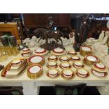 A Waring and Gillows, gilt, red and white 12 place dinner set (approx.