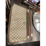 A vintage Gucci case