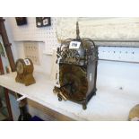 A brass lantern clock