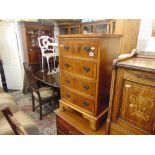 A Cross banded chest of four drawers