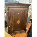 A 19th century inlaid Oak corner cupboard