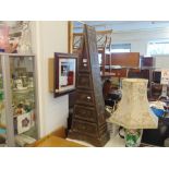 A wooden pyramid chest of drawers