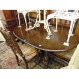 An Ercol extending dining table with six match chairs