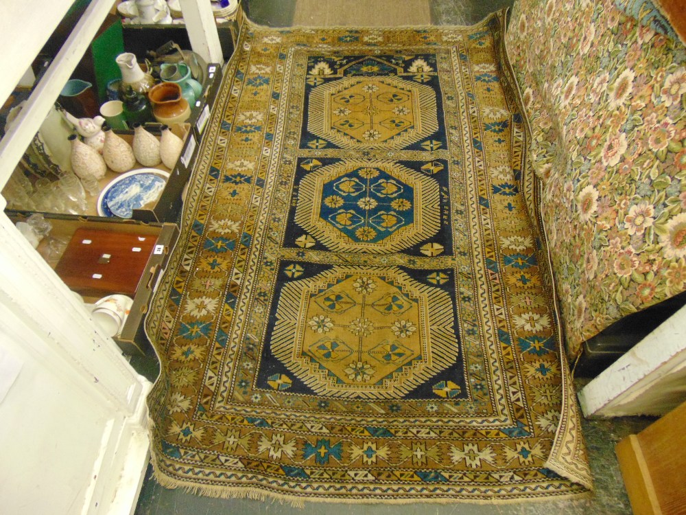 A Caucasian blue/ brown rug