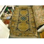 A Caucasian blue/ brown rug