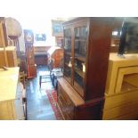 A bookcase over three drawer chest