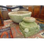 A large stone planter on stand,