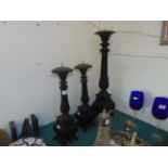 A set of three wood pricket candlesticks