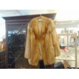 A ladies red Fox fur jacket,