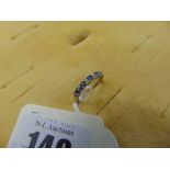 An 18ct gold, Diamond and Sapphire half eternity ring,