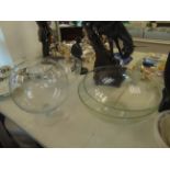 Three large glass bowls and a fruit bowl