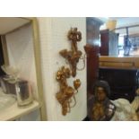 A pair of carved wall lights,