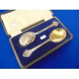 A set hallmarked Silver gilded Walker and Hall serving spoons,
