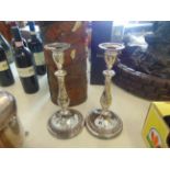 A pair of silver plated candlesticks
