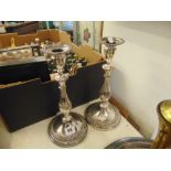 A pair of silver plated candlesticks