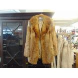 A ladies red Fox fur jacket,